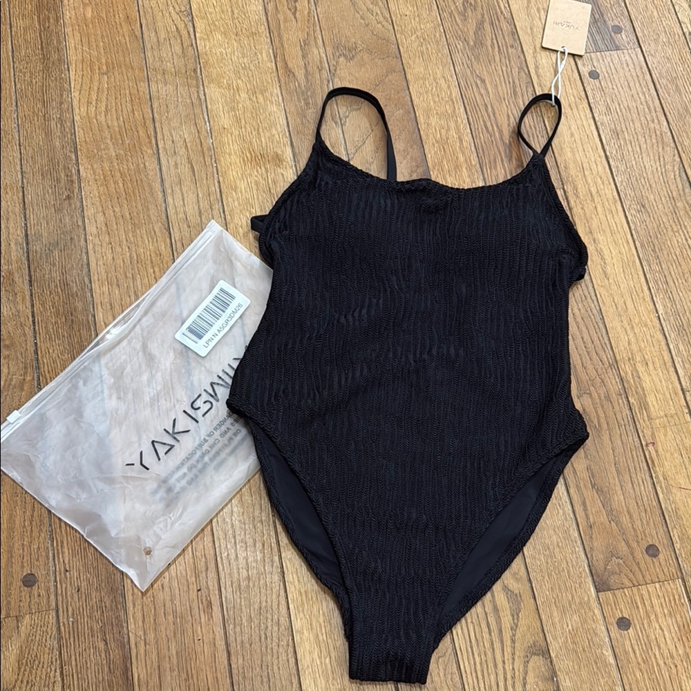 Sleek Black One Piece Swimsuit with High-Cut Design